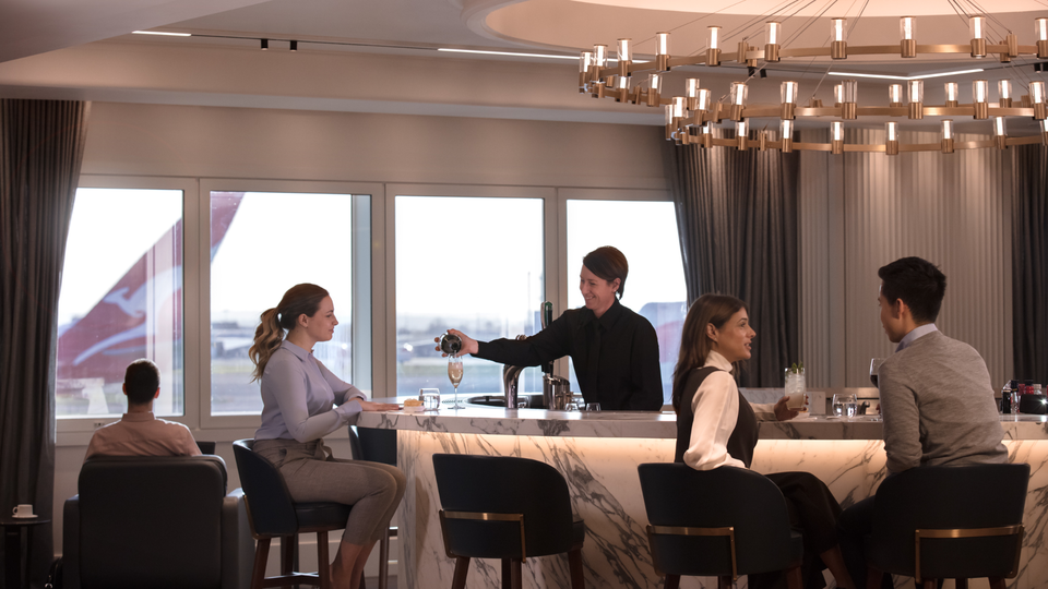 Drinks with a view at the Qantas London Heathrow lounge's cocktail bar.